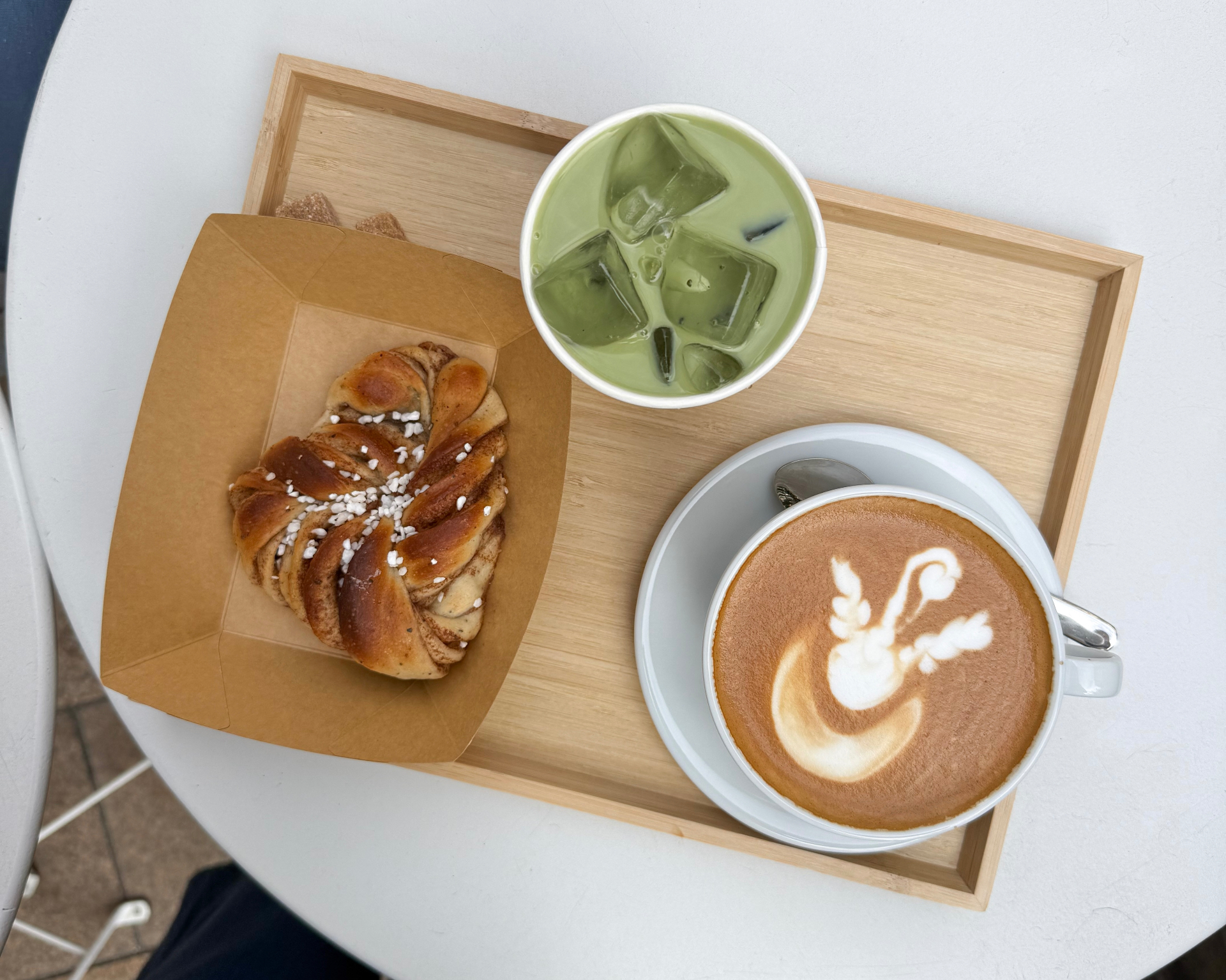 Lifestyle flat lay with coffee and pastry